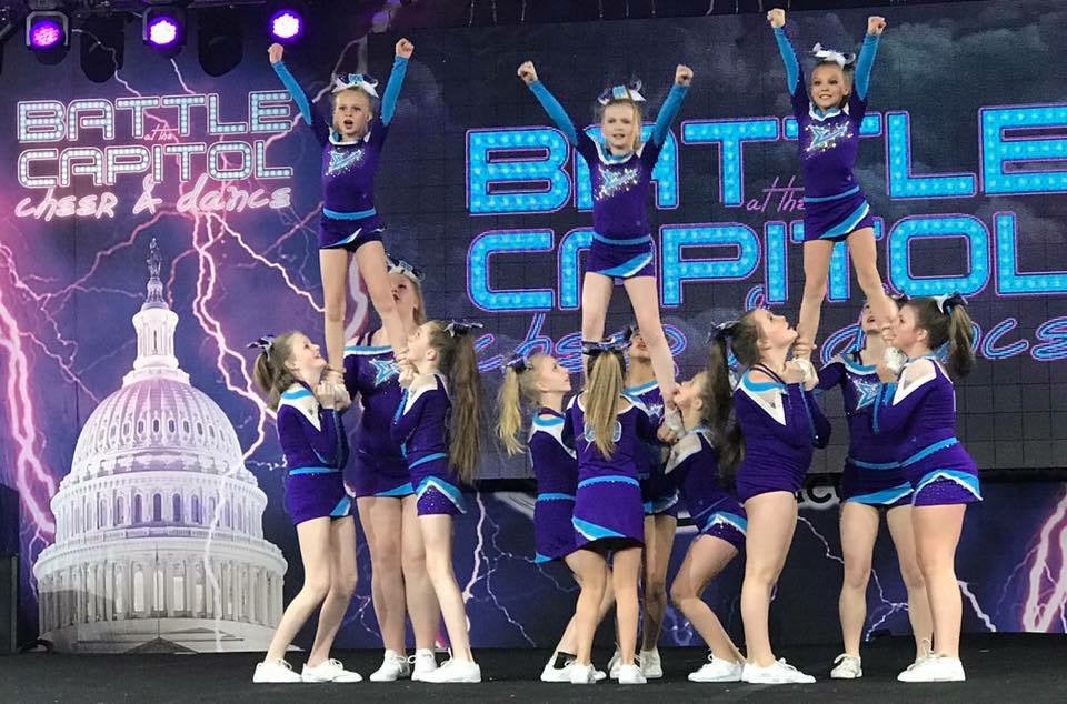 Local cheerleading program climbs its way to national summit