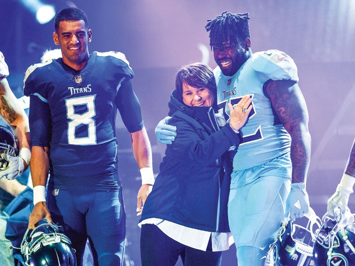 Taylor Lewan gets his first look at the Titans new uniforms