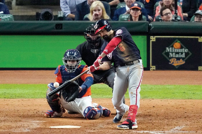 The Washington Nationals celebrate with the trophy after Game 7 of the  baseball World Series against the Houston Astros Wednesday, Oct. 30, 2019,  in Houston. The Nationals won 6-2 to win the