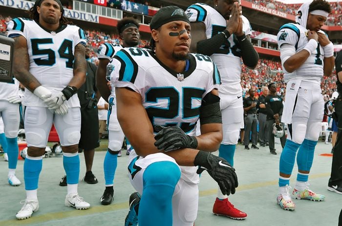 Carolina Panthers strong safety Eric Reid (25) kneels along the