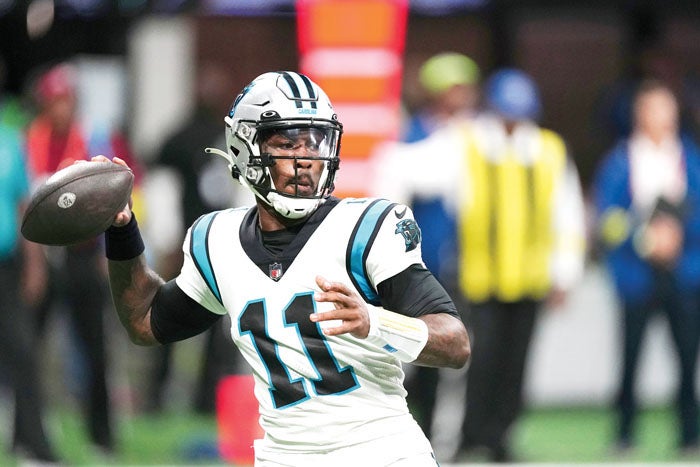 Carolina Panthers quarterback P.J. Walker (6) runs off the field